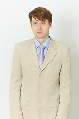 Image showing Young man in light jacket - front view