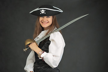 Image showing Laughing pirate in hat armed with sabre