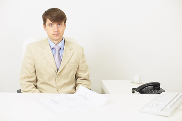 Image showing Serious businessman attentively listens