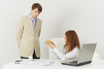 Image showing Two businessmen during lunch break