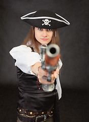 Image showing Woman - pirate aims in us from an ancient pistol