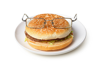 Image showing Amusing hamburger in spectacles isolated on white background