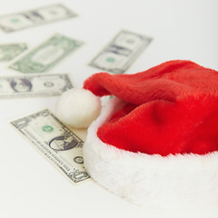 Image showing Christmas cap and the scattered money