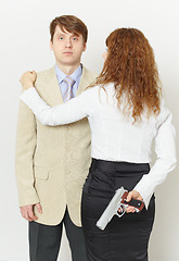 Image showing Pair of young men - woman with pistol and man