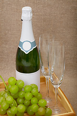 Image showing Sparkling wine with grapes and wine glasses