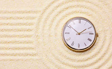 Image showing Old watch on sand in composition of Japanese rock-garden