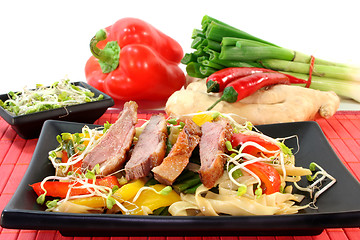 Image showing Duck breast with fried noodles