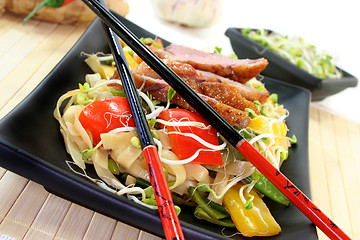 Image showing Duck breast with fried noodles