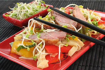 Image showing Duck breast with fried noodles