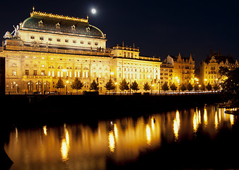 Image showing A golden cover over Prague's National Theater along the Vitave river.