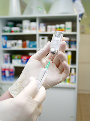 Image showing syringe that is being filled with vaccine