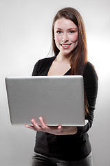 Image showing Businesswoman holding a laptop