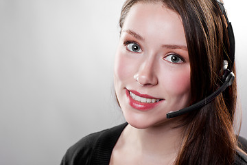 Image showing Businesswoman wearing a headset