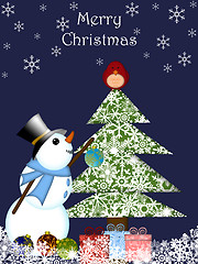 Image showing Christmas Snowman Hanging Ornament on Tree with Red Cardinal Bir