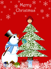 Image showing Christmas Snowman Hanging Ornament on Tree with Red Cardinal Bir