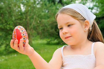 Image showing Little girl holding Easter egg