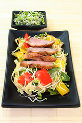 Image showing Duck breast with fried noodles