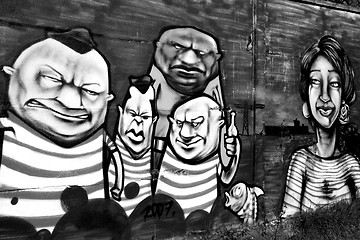 Image showing Graffiti with a group of disturbing individuals.
