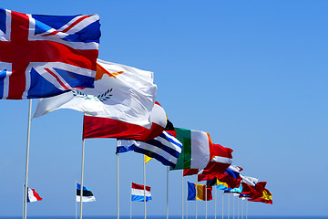 Image showing Flags of the EU against blue sky