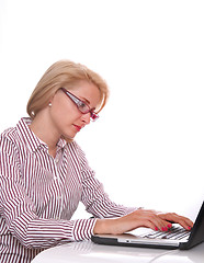 Image showing young business woman using laptop at work desk