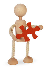 Image showing A figure holds a puzzle