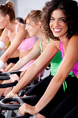 Image showing people spinning on bicycles in a gym