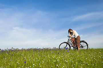 Image showing Girl with a bicycle