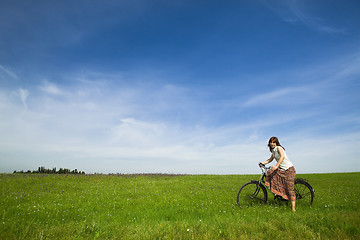 Image showing Girl with a bicycle