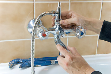 Image showing plumber and tap