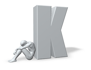 Image showing sitting man leans on uppercase letter k