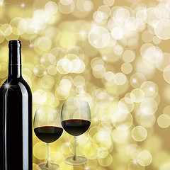 Image showing Red Wine Bottle and Two Glasses Bokeh Background