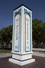 Image showing Post marking the entrance to the pier