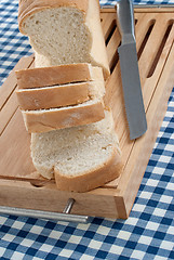 Image showing Slices of bread on top of wooden board