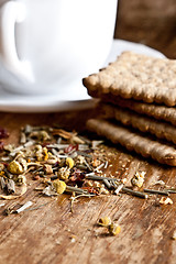 Image showing  fresh herbal tea and some cookies