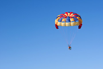 Image showing Parasailing under blue sky.