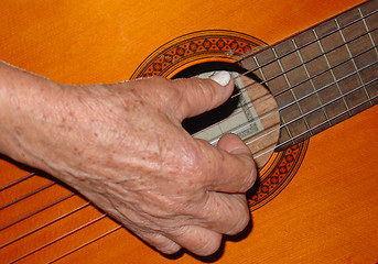 Image showing ancient playing the guitar