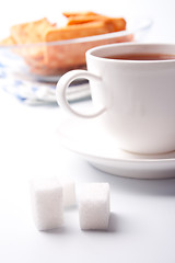 Image showing cup of tea, sugar and cookies