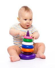 Image showing Little boy play with toys