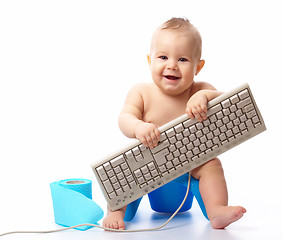 Image showing Little child with keyboard