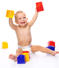 Image showing Happy little boy with building bricks