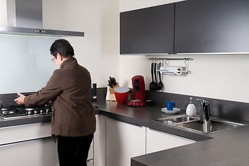 Image showing Senior woman cooking