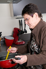 Image showing Senior woman cooking