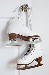 Image showing Figure skates hanging on a door knob