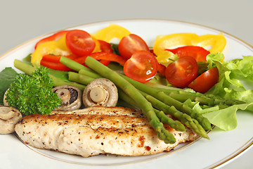 Image showing Fried fish, asparagus and salad