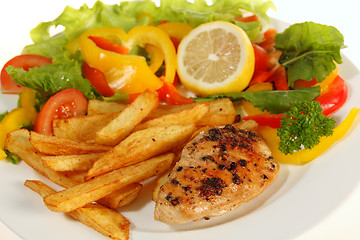 Image showing Lemon pepper chicken and fries