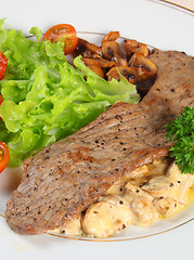Image showing Veal with mushrooms in cream sauce vertical