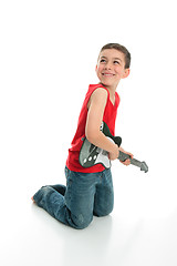 Image showing Little boy playing guitar