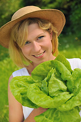 Image showing Young woman holding fresh lettuce