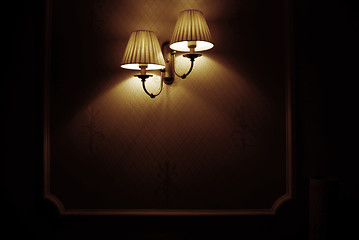 Image showing Photo of wall lamp with dim light    