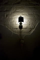 Image showing Photo of wall lamp with dim light   